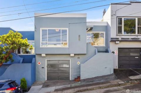 a front view of a house with a garage