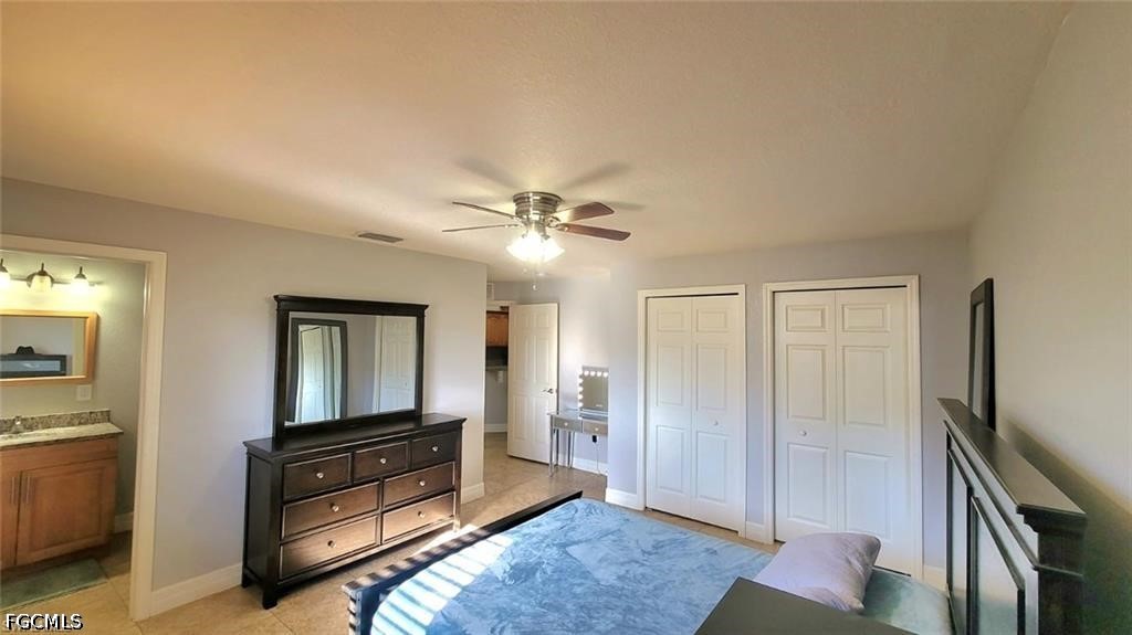 152 Pullman Street Lehigh Acres, FL 33974 - Photo 9 of 15 a living room with furniture and a flat screen tv