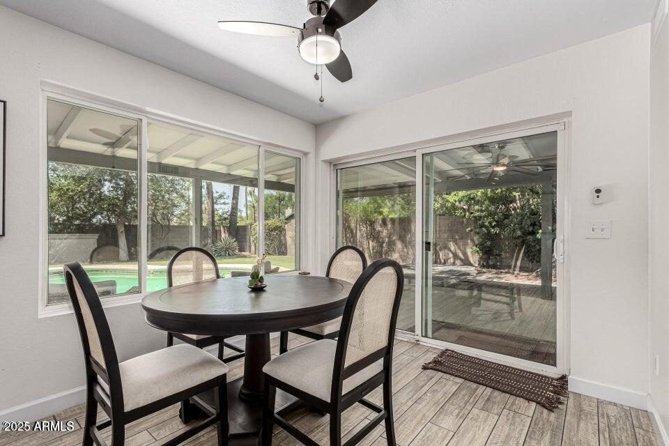 4909 East Waltann Lane Scottsdale, AZ 85254 - Photo 11 of 34 a dining room with furniture window and outside view