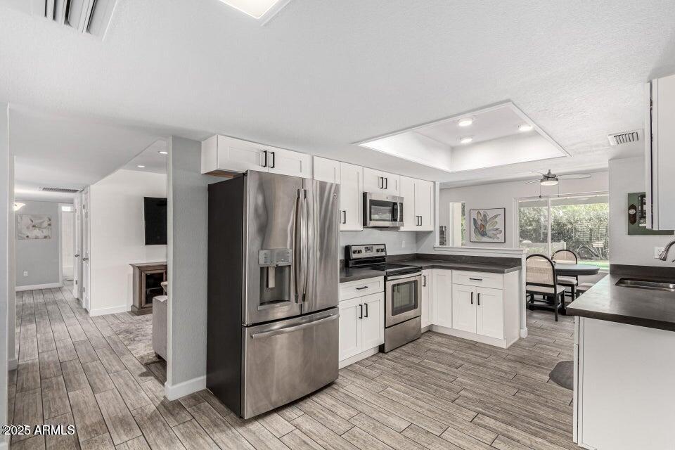 4909 East Waltann Lane Scottsdale, AZ 85254 - Photo 14 of 34 a kitchen with stainless steel appliances a refrigerator stove and sink