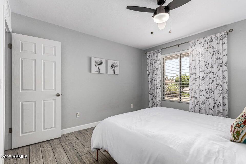 4909 East Waltann Lane Scottsdale, AZ 85254 - Photo 19 of 34 a bedroom with a bed and a window