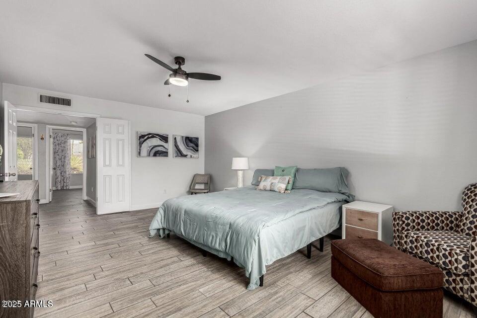 4909 East Waltann Lane Scottsdale, AZ 85254 - Photo 23 of 34 a bedroom with a bed couch and a window