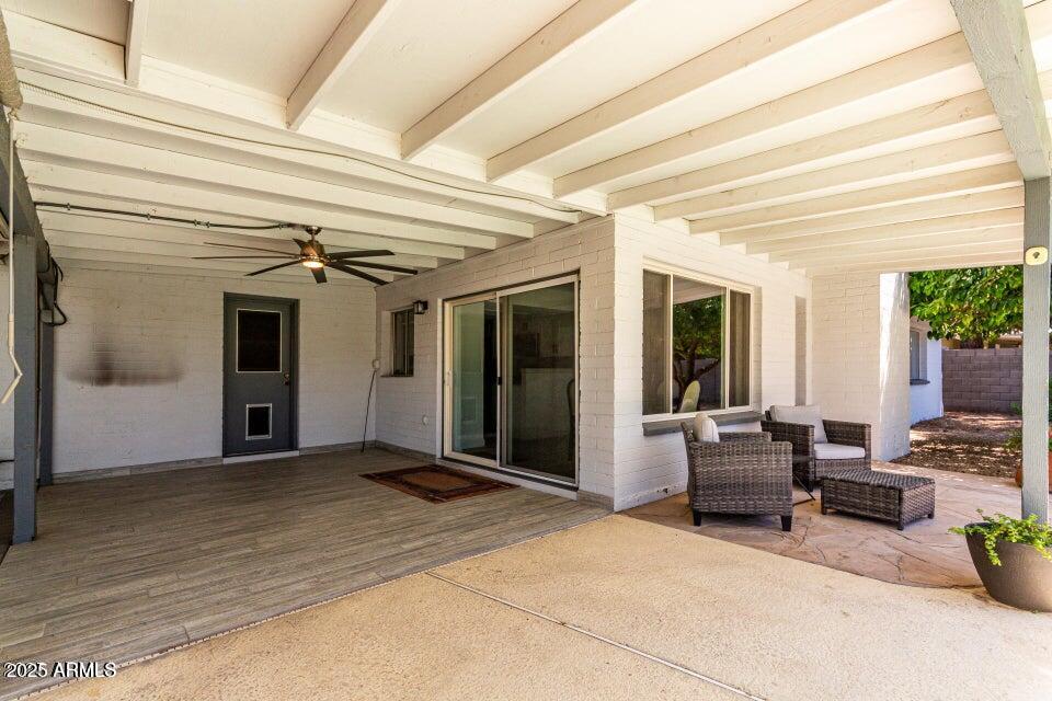 4909 East Waltann Lane Scottsdale, AZ 85254 - Photo 28 of 34 a view of a patio with table and chairs and potted plants
