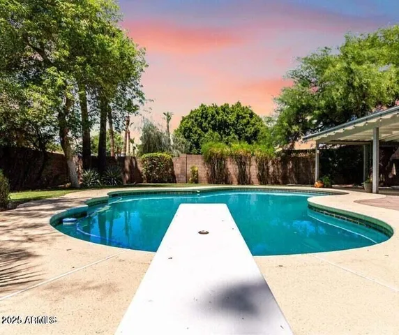 a view of swimming pool with garden