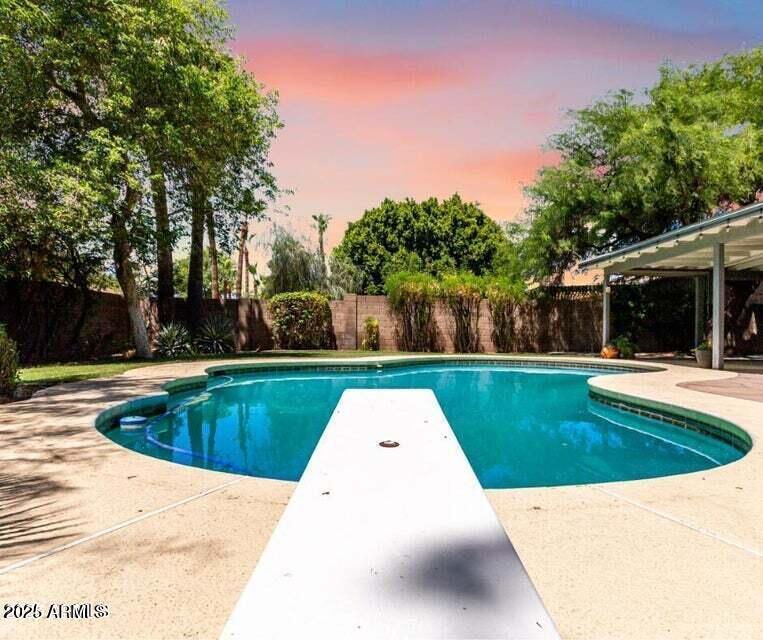 4909 East Waltann Lane Scottsdale, AZ 85254 - Photo 29 of 34 a view of swimming pool with garden