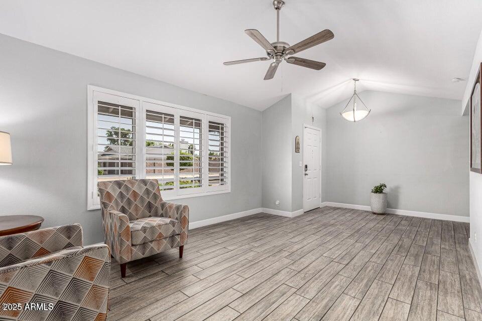 4909 East Waltann Lane Scottsdale, AZ 85254 - Photo 5 of 34 a living room with furniture and a large window