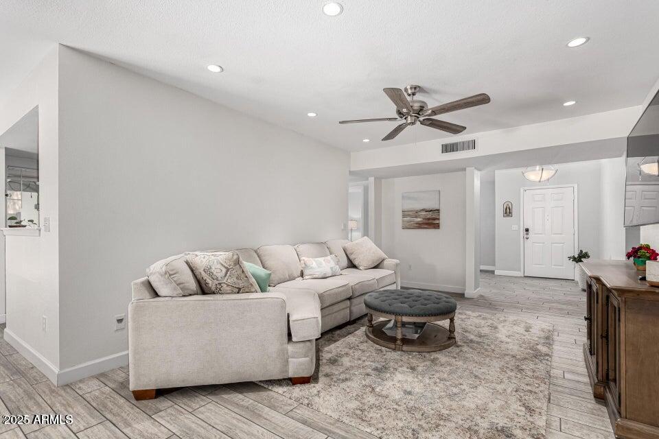 4909 East Waltann Lane Scottsdale, AZ 85254 - Photo 7 of 34 a living room with furniture and a rug