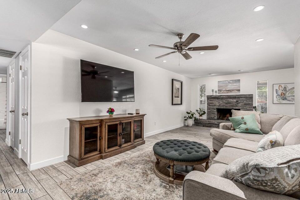 4909 East Waltann Lane Scottsdale, AZ 85254 - Photo 8 of 34 a living room with furniture a flat screen tv and a fireplace