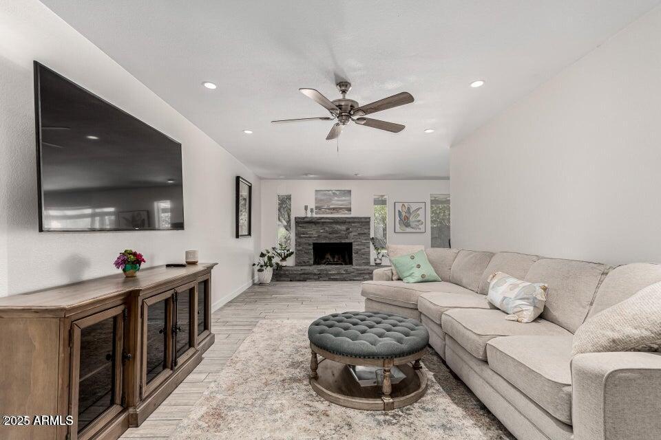 4909 East Waltann Lane Scottsdale, AZ 85254 - Photo 9 of 34 a living room with furniture and a flat screen tv