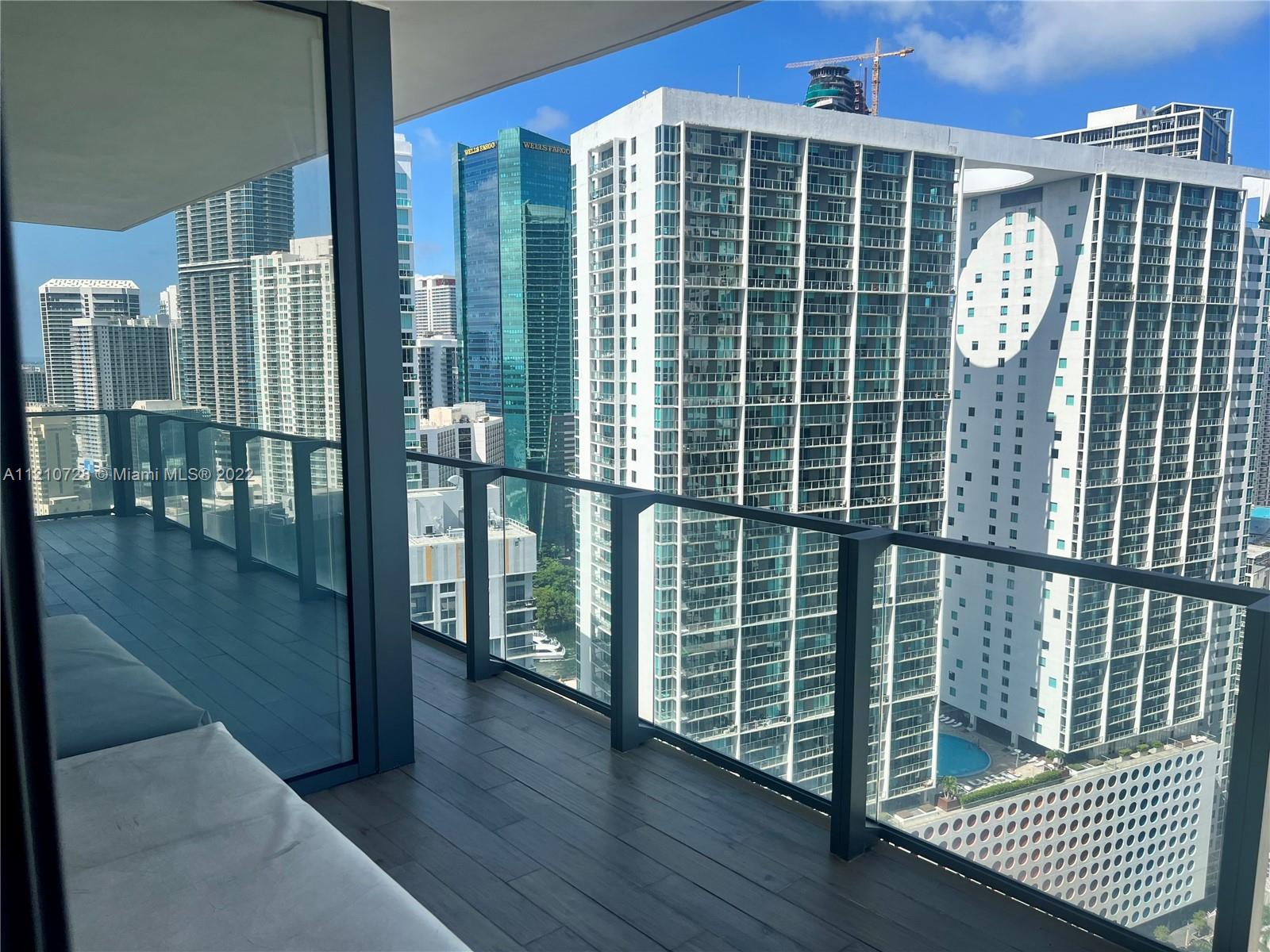 68 Southeast 6th Street, Unit 2801 Miami, FL 33131 - Photo 12 of 40 a view of balcony with wooden floor