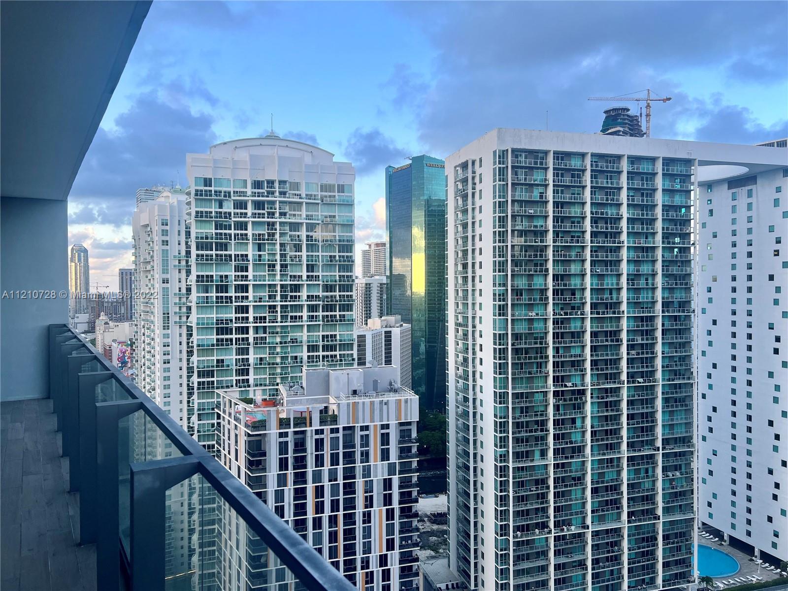 68 Southeast 6th Street, Unit 2801 Miami, FL 33131 - Photo 16 of 40 a view of a balcony with a staircase