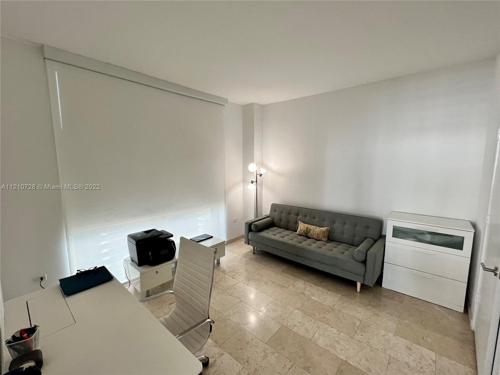 68 Southeast 6th Street, Unit 2801 Miami, FL 33131 - Photo 27 of 40 a living room with furniture and a couch