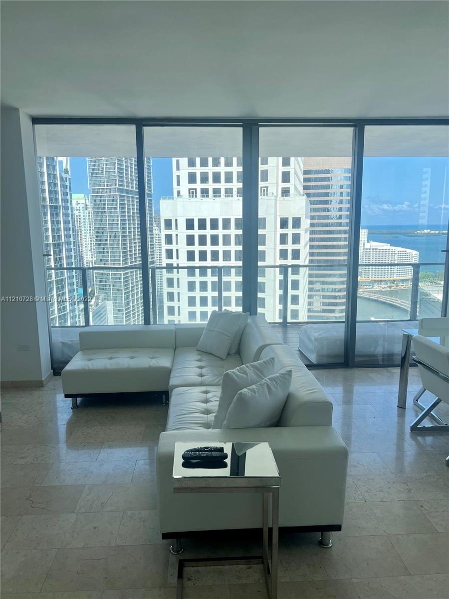 68 Southeast 6th Street, Unit 2801 Miami, FL 33131 - Photo 37 of 40 a living room with furniture and a window