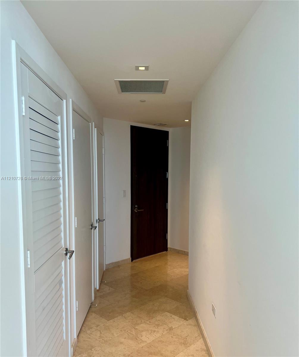 68 Southeast 6th Street, Unit 2801 Miami, FL 33131 - Photo 39 of 40 a view of a hallway
