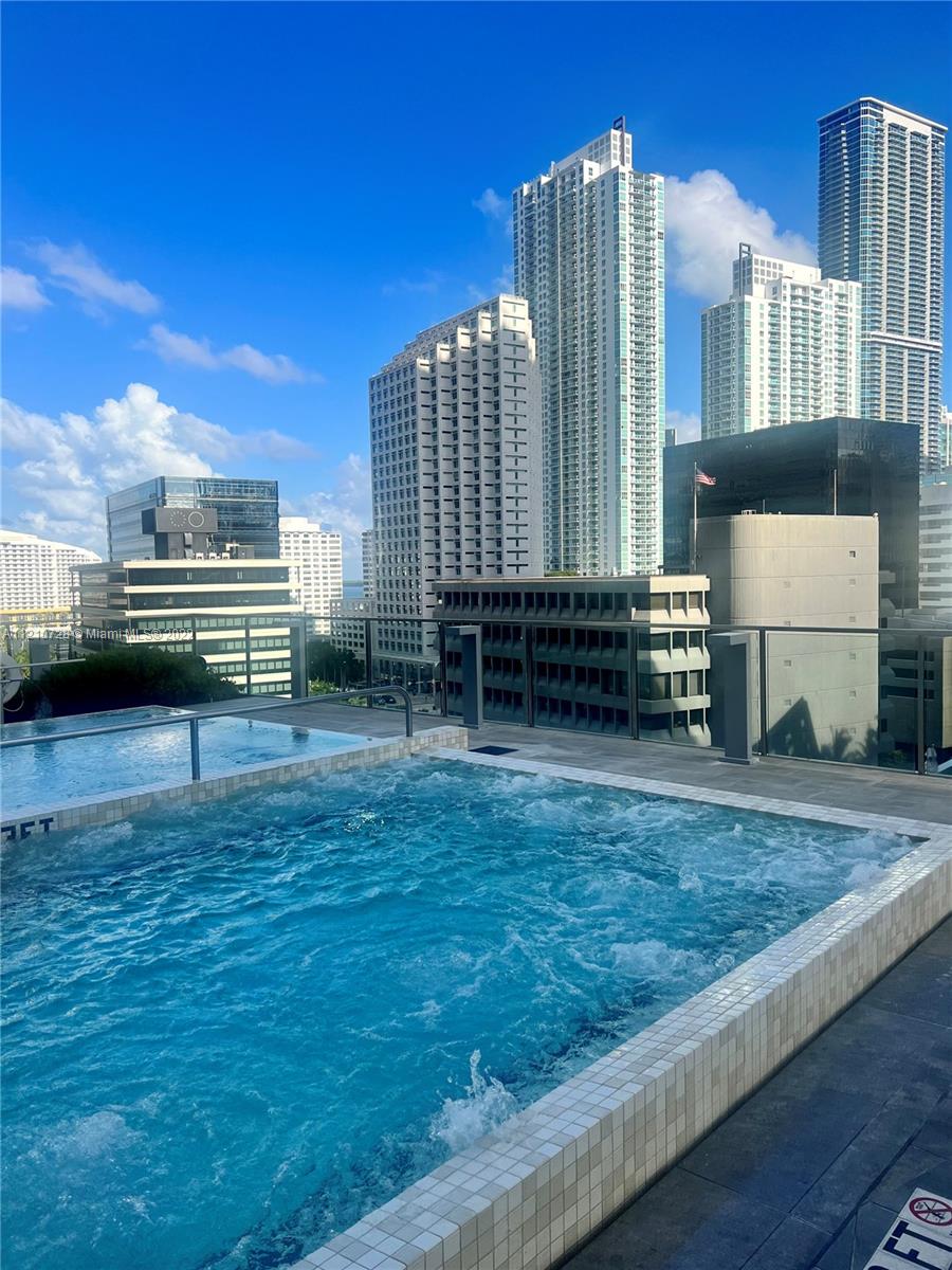 68 Southeast 6th Street, Unit 2801 Miami, FL 33131 - Photo 6 of 40 a view of a city with tall buildings