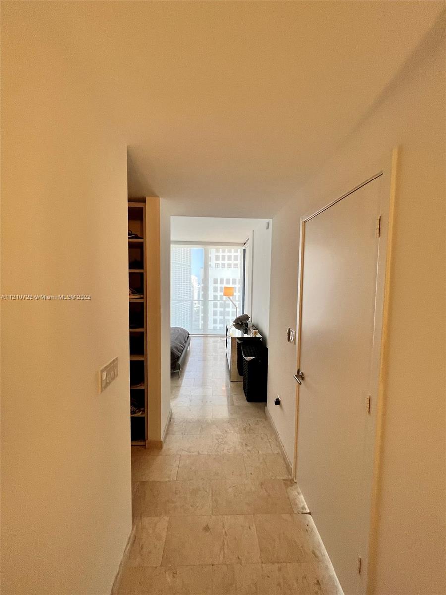 68 Southeast 6th Street, Unit 2801 Miami, FL 33131 - Photo 7 of 40 a view of a living room with furniture and a gate