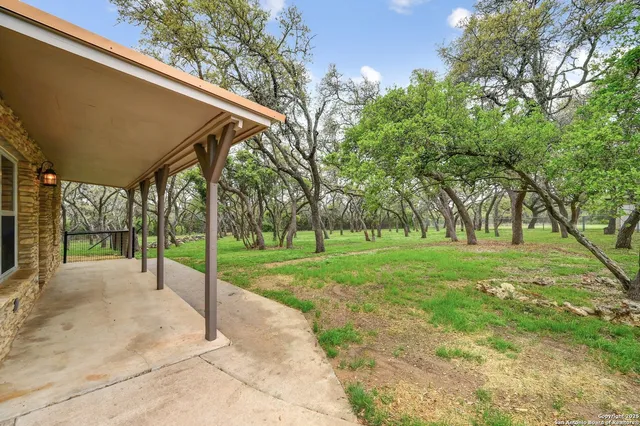 a view of a road with a big yard