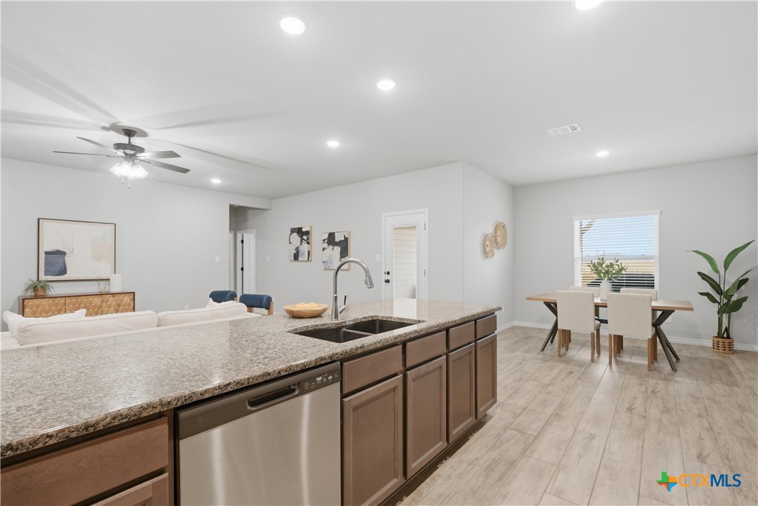 3201 Hedwig Street Killeen, TX 76549 - Photo 10 of 38 a kitchen with granite countertop a sink and cabinets