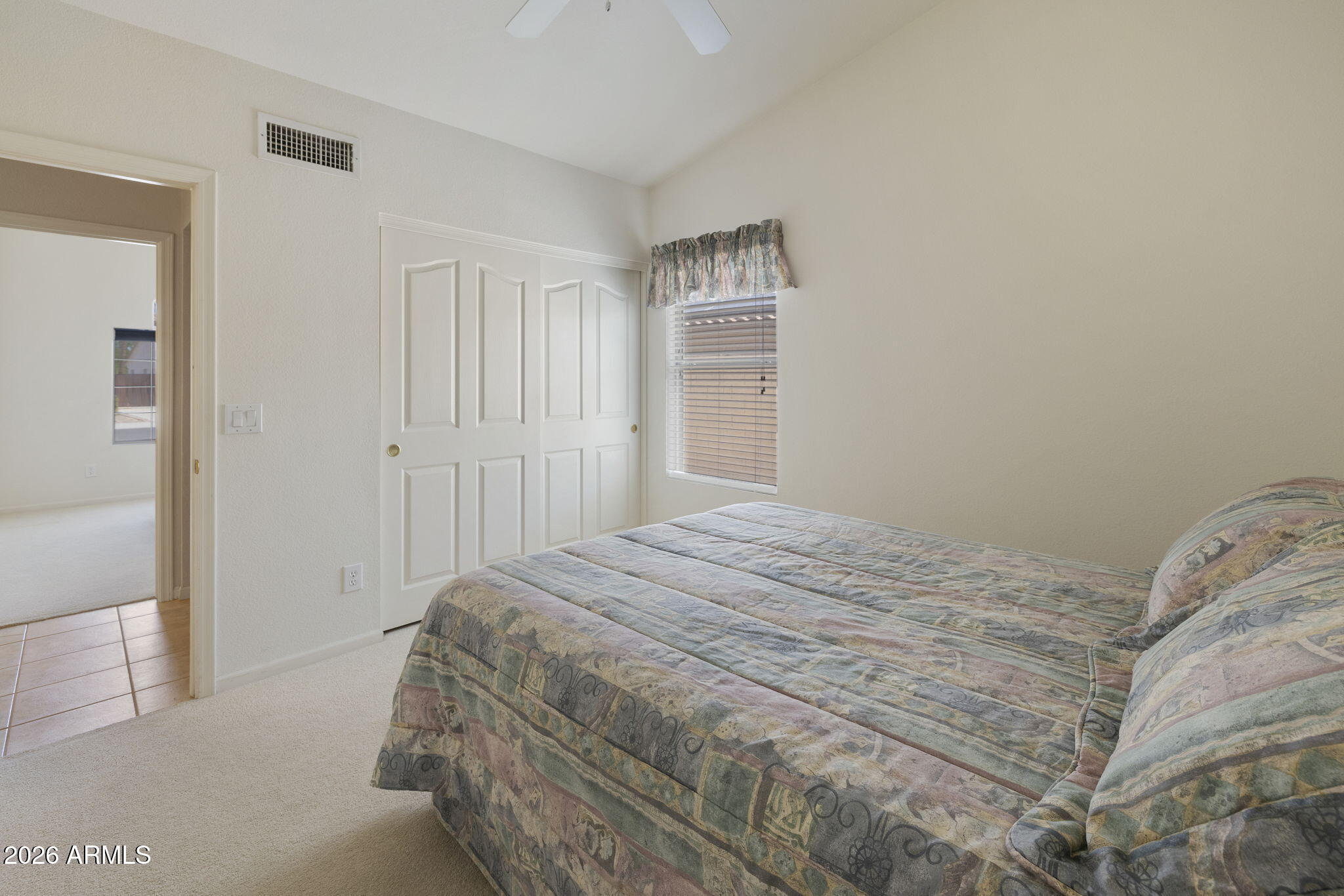 12435 West Monte Vista Road Avondale, AZ 85392 - Photo 31 of 69 a bedroom with a bed and a window