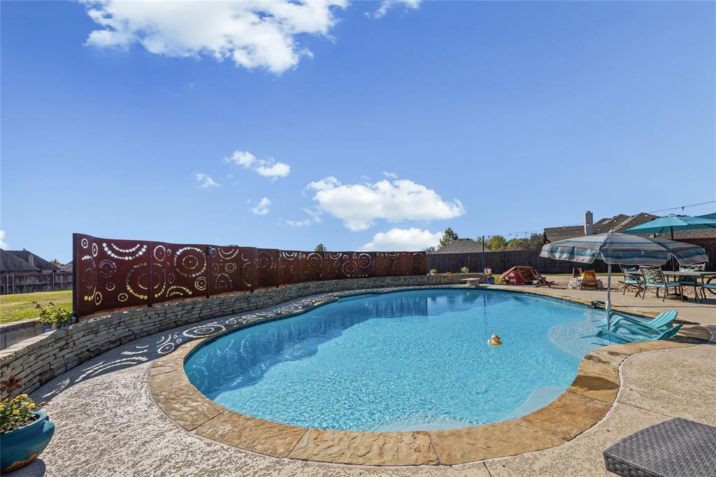 112 Springfield Lane Red Oak, TX 75165 - Photo 29 of 40 a view of a swimming pool with a patio