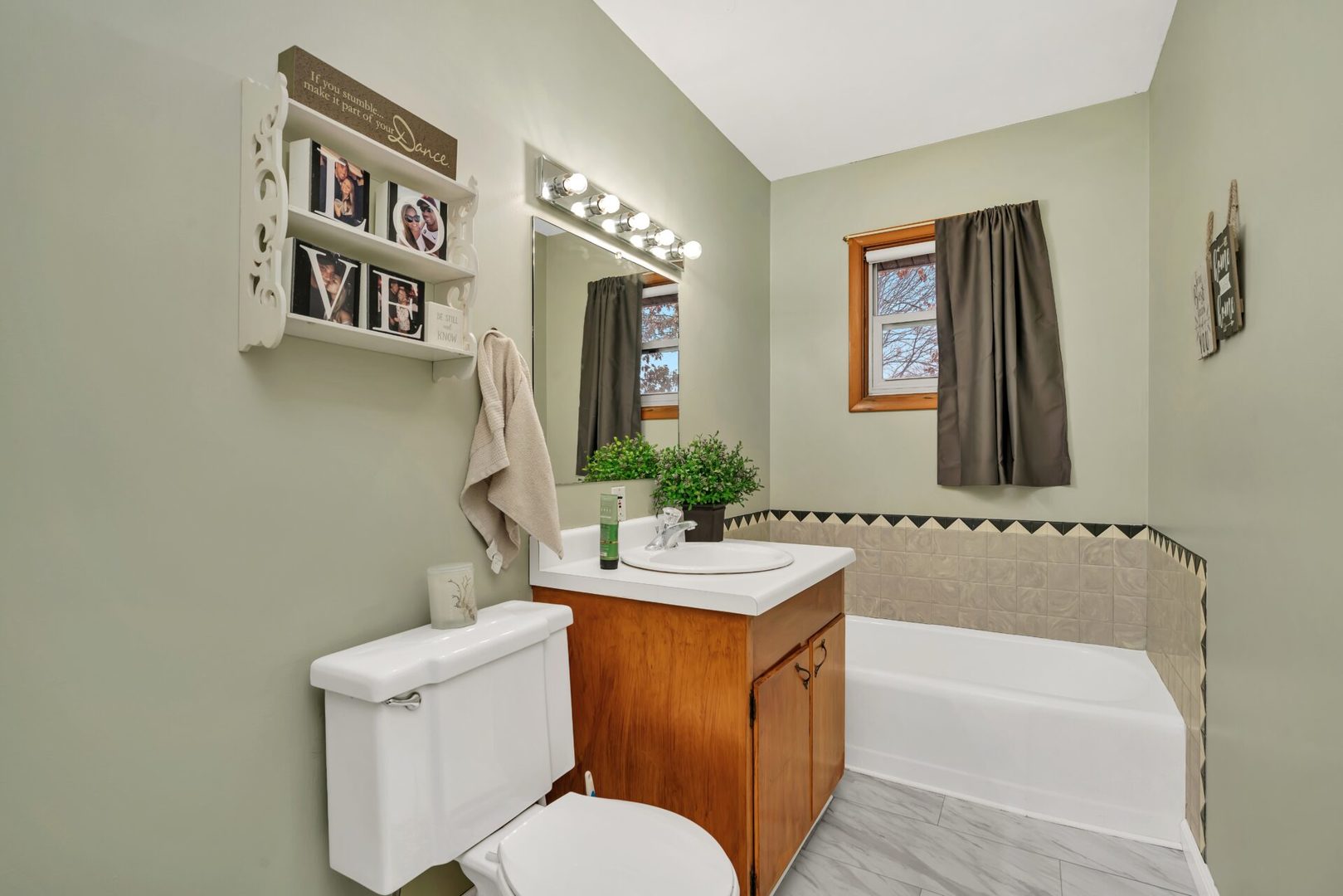 119 Davis Street Seneca, IL 61360 - Photo 17 of 21 a bathroom with a sink a toilet and mirror