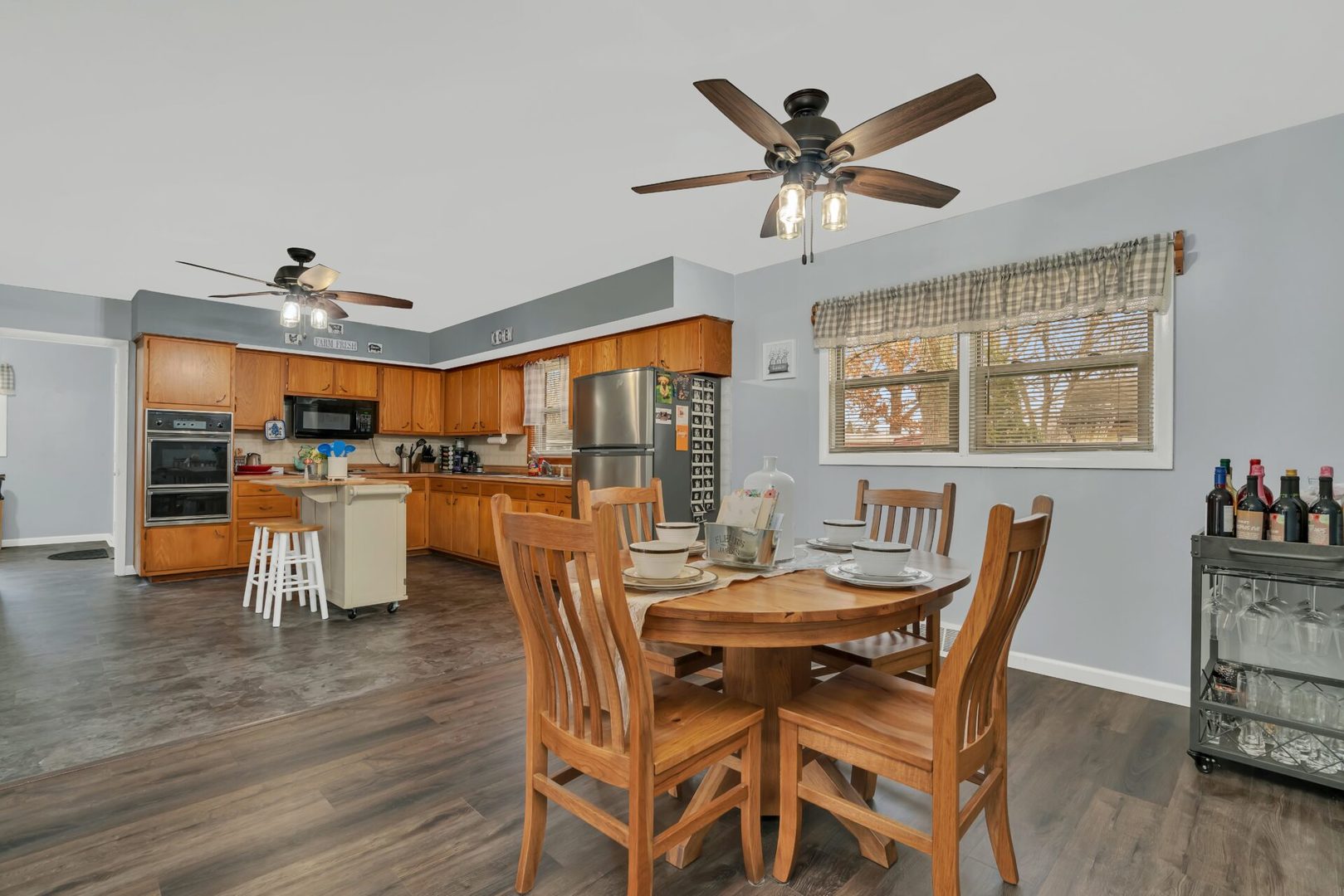 119 Davis Street Seneca, IL 61360 - Photo 19 of 21 a dining room with furniture a kitchen view and chandelier