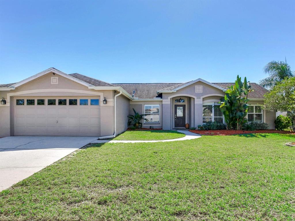 12908 Raysbrook Drive Riverview, FL 33569 - Photo 1 of 1 a front view of a house with a garden