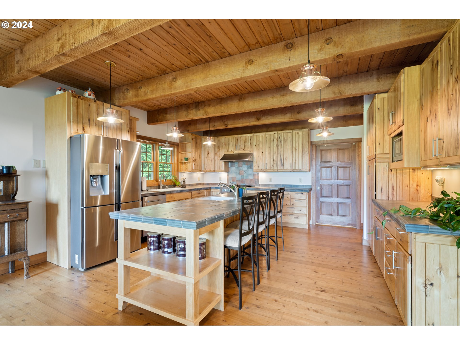 2705 Netarts Bay Drive Netarts, OR 97141 - Photo 14 of 48 a dining hall with stainless steel appliances kitchen island granite countertop furniture and a kitchen view
