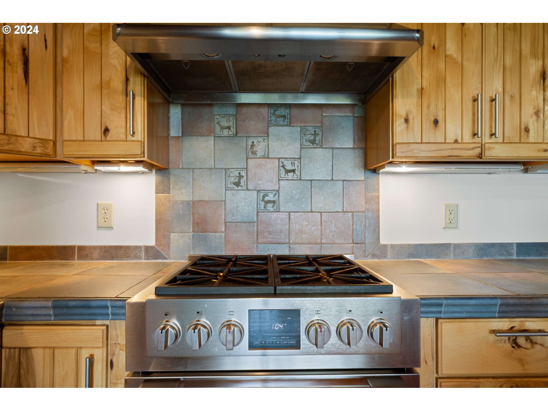 2705 Netarts Bay Drive Netarts, OR 97141 - Photo 15 of 48 a kitchen with stainless steel appliances granite countertop a stove and cabinets