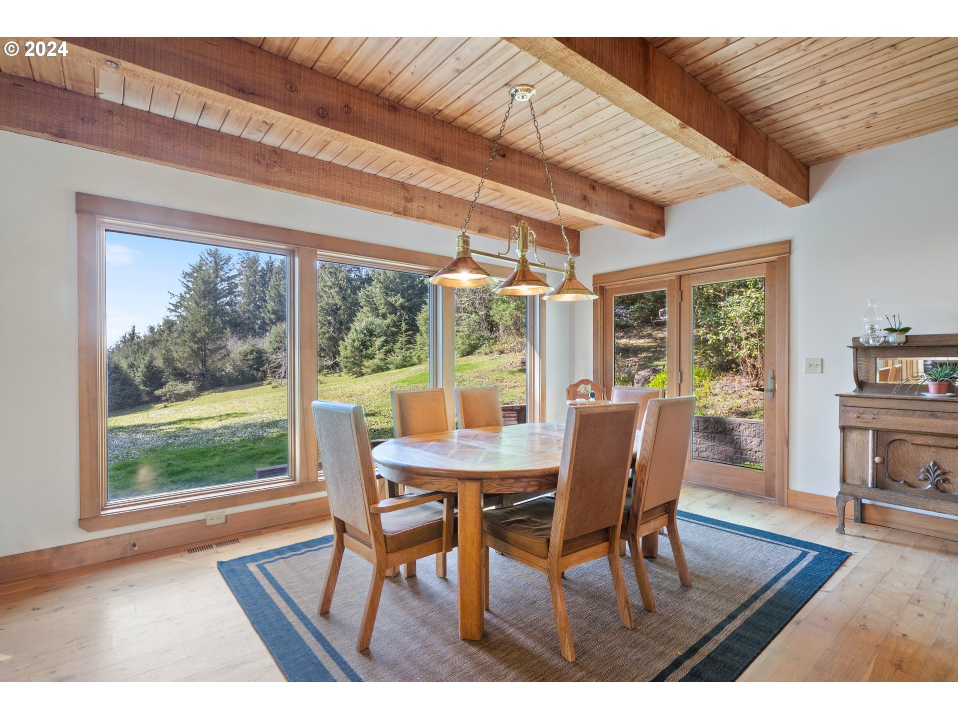 2705 Netarts Bay Drive Netarts, OR 97141 - Photo 18 of 48 a dining room with furniture window and wooden floor