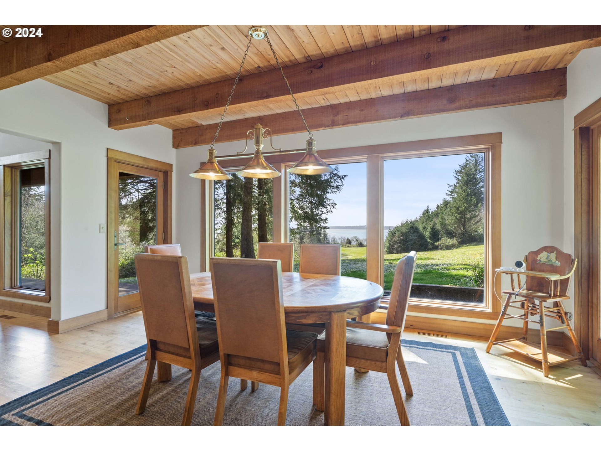 2705 Netarts Bay Drive Netarts, OR 97141 - Photo 19 of 48 a dining room with furniture window and wooden floor