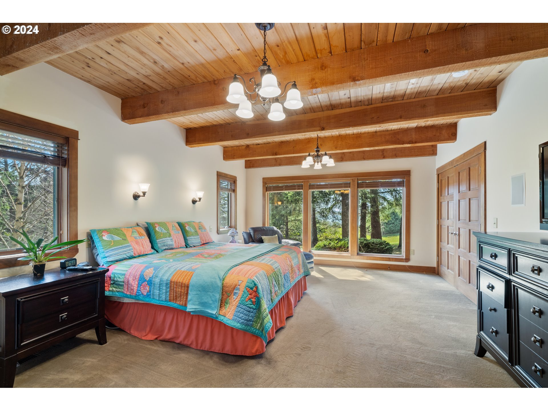 2705 Netarts Bay Drive Netarts, OR 97141 - Photo 20 of 48 a bedroom with a bed mirror and a large window