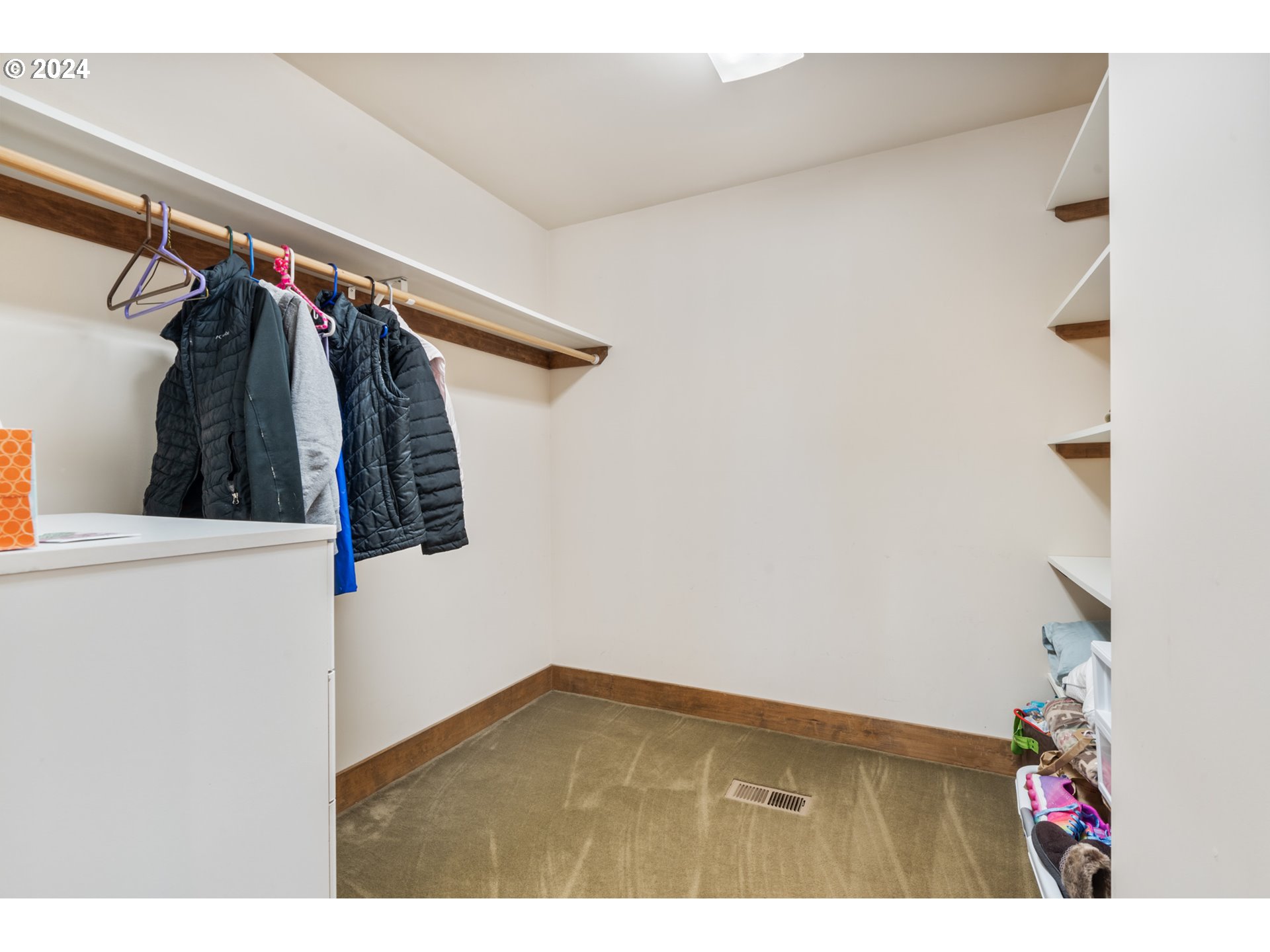 2705 Netarts Bay Drive Netarts, OR 97141 - Photo 24 of 48 a view of walk in closet with clothes and shoes
