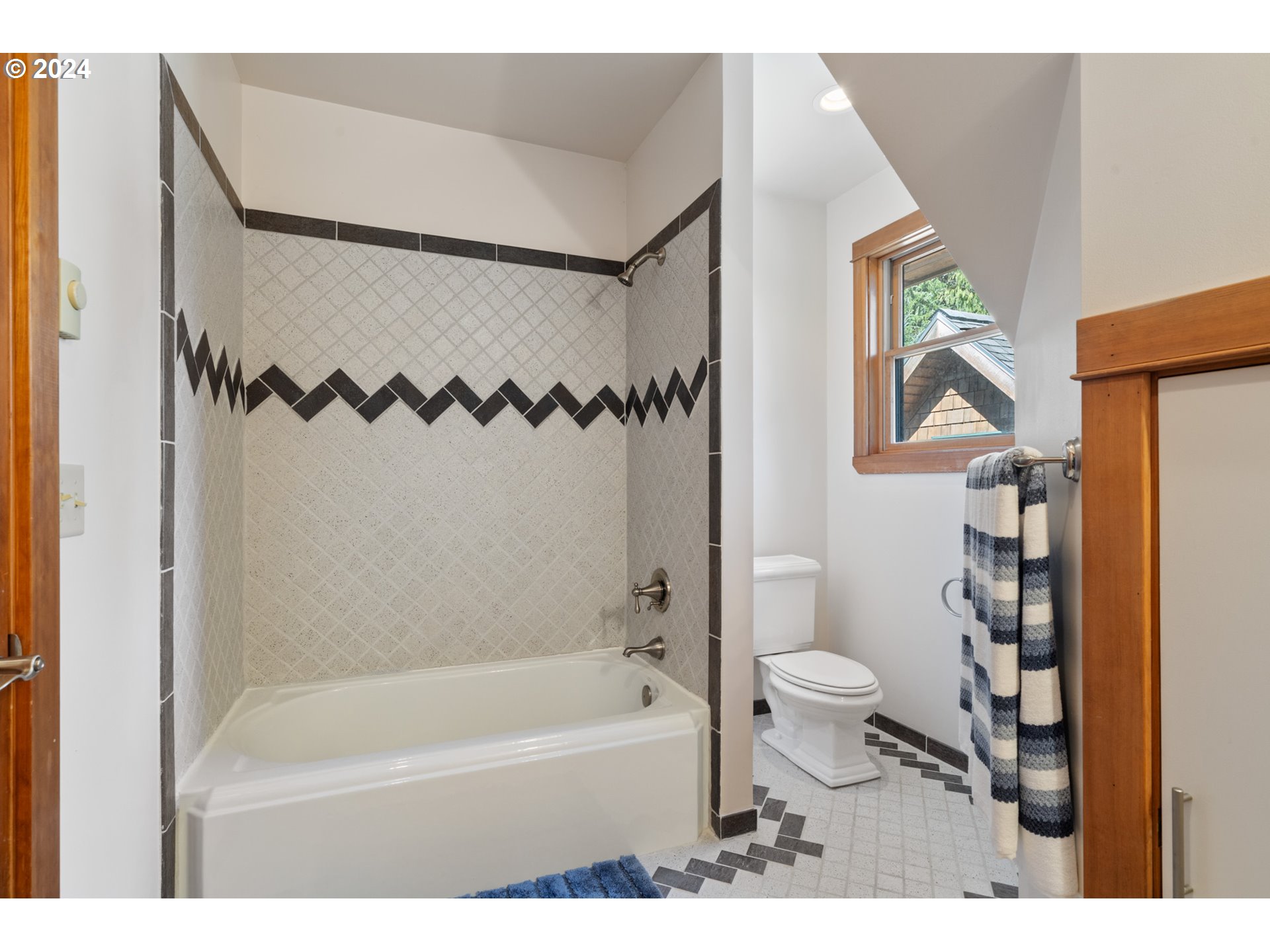 2705 Netarts Bay Drive Netarts, OR 97141 - Photo 30 of 48 a bathroom with a toilet and a bathtub