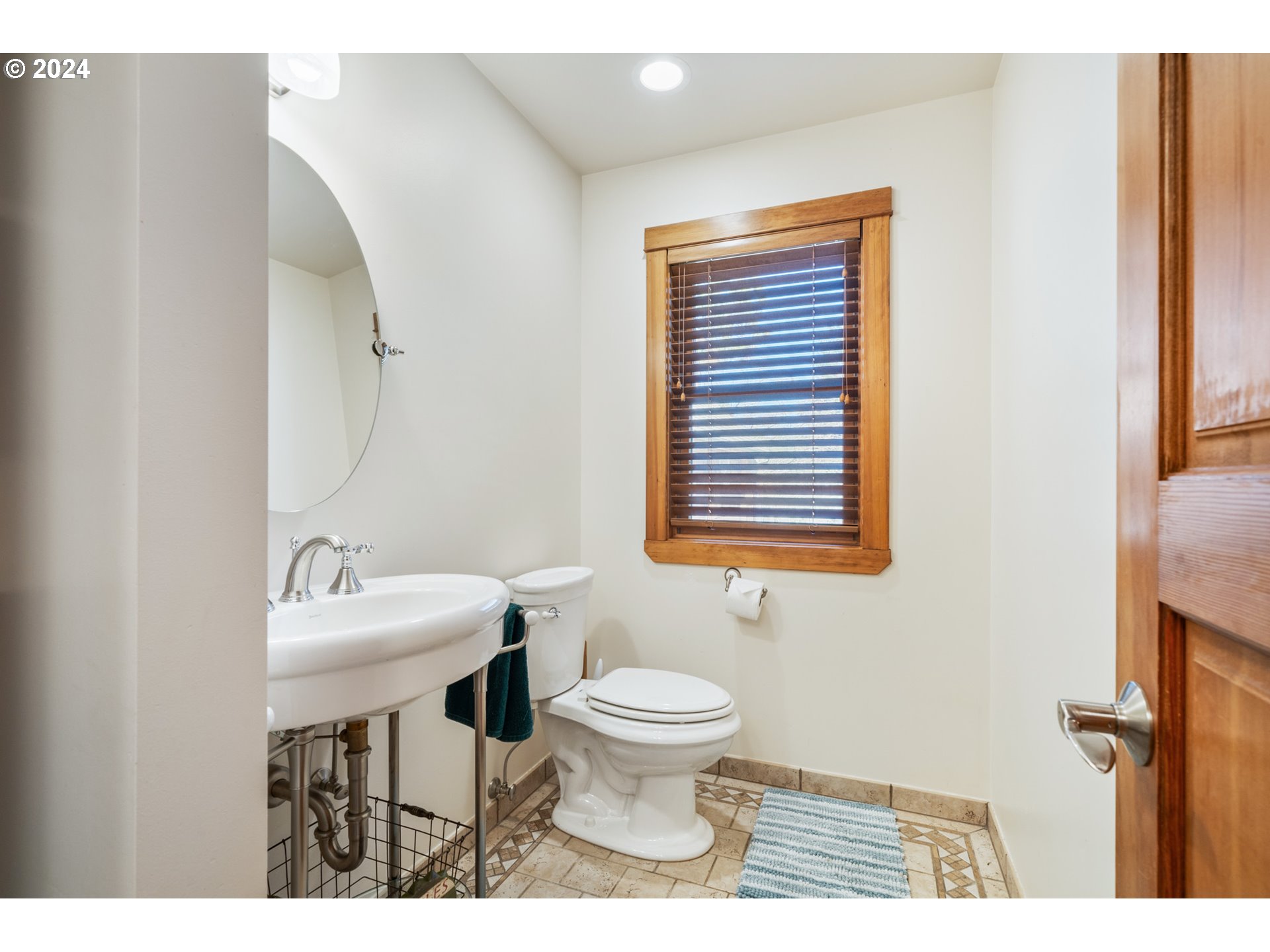 2705 Netarts Bay Drive Netarts, OR 97141 - Photo 35 of 48 a bathroom with a sink a toilet and a mirror