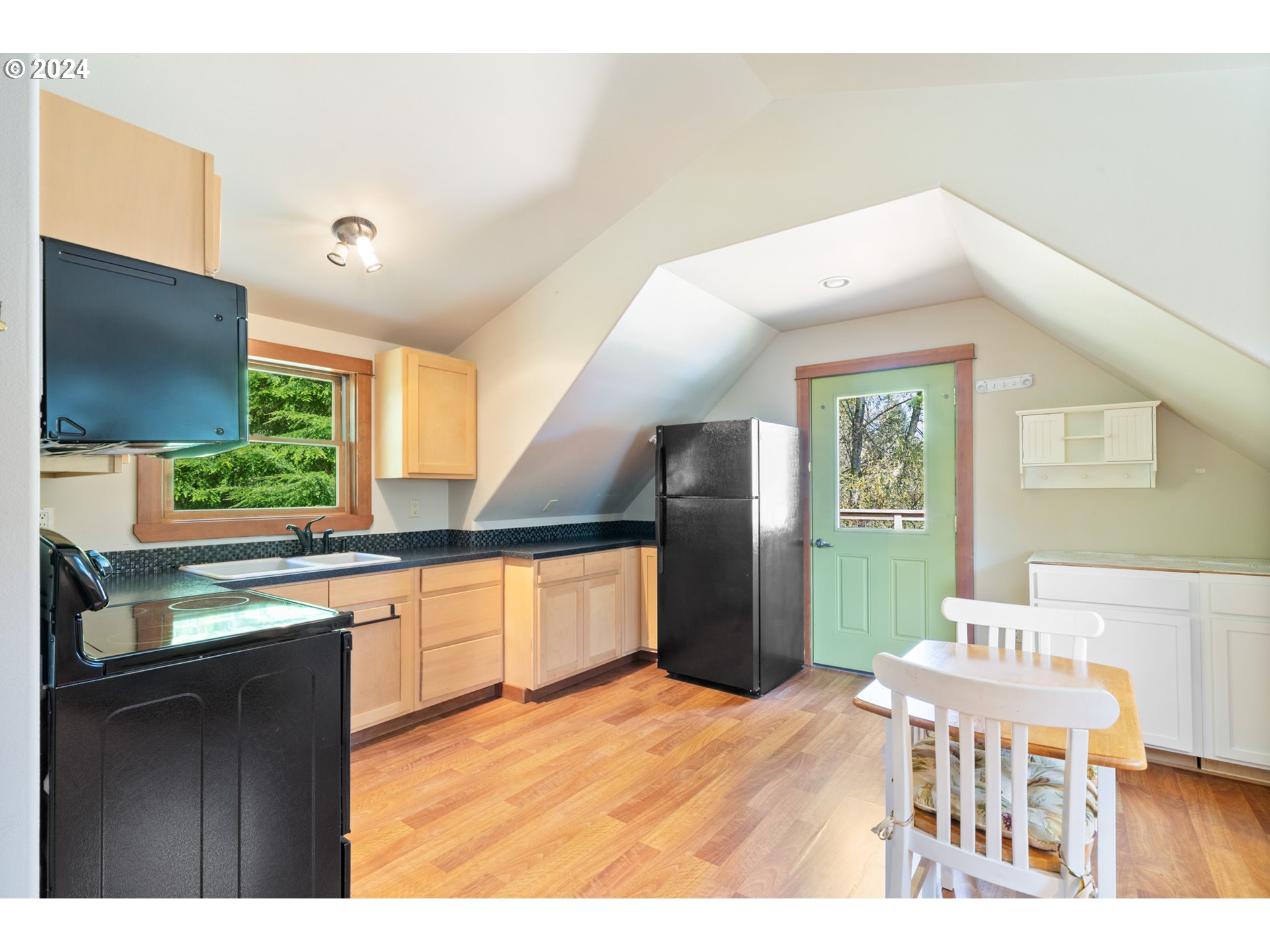 2705 Netarts Bay Drive Netarts, OR 97141 - Photo 40 of 48 a kitchen with stainless steel appliances kitchen island granite countertop a refrigerator a sink a stove and island