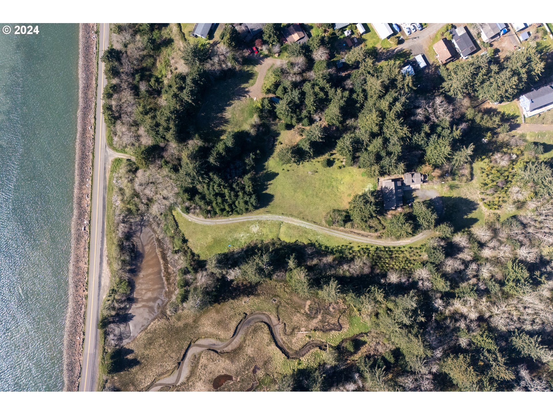 2705 Netarts Bay Drive Netarts, OR 97141 - Photo 4 of 48 a view of a lake in a backyard