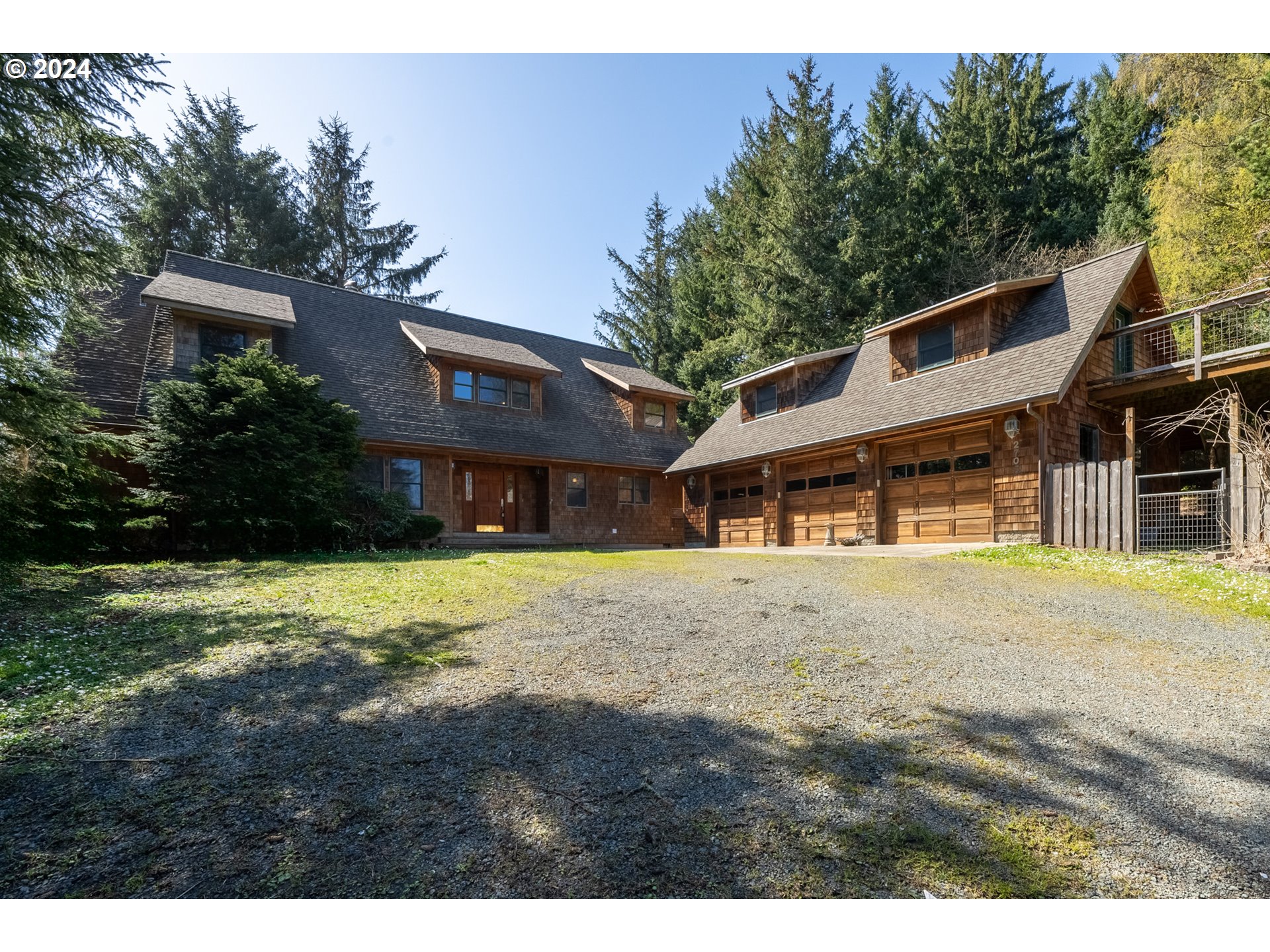 2705 Netarts Bay Drive Netarts, OR 97141 - Photo 45 of 48 a front view of a house with a garden