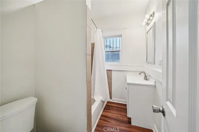 a view of a hallway with washer and dryer