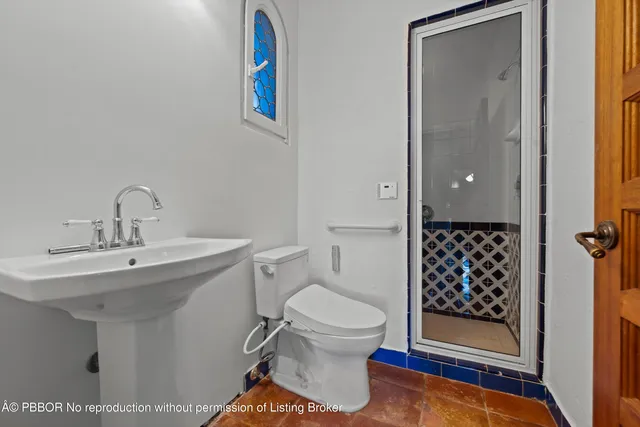 a bathroom with a toilet and a sink