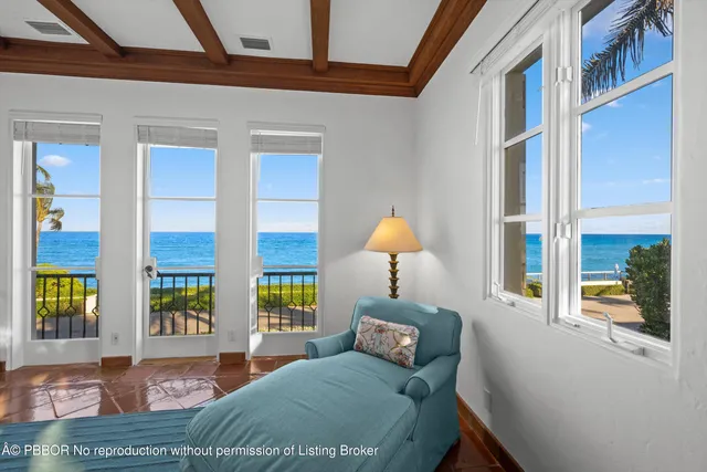 a bed room with a bed and a large window