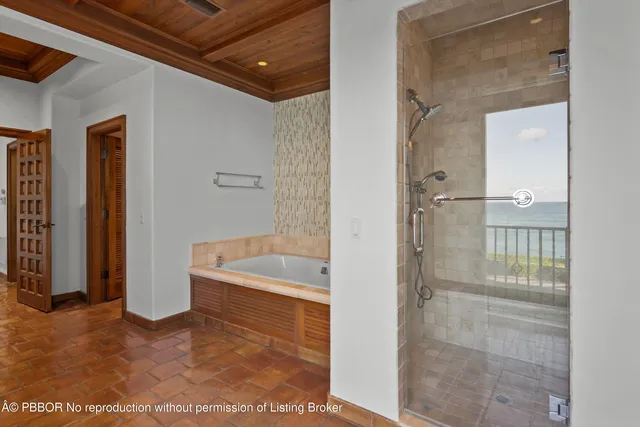 a bathroom with a tub and shower