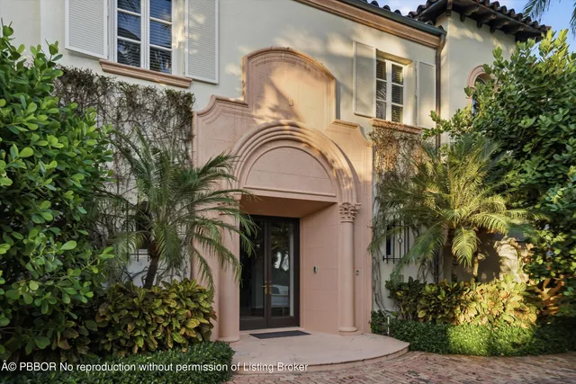 a view of a house with a small yard