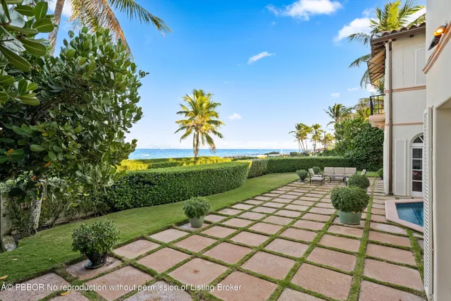 a view of swimming pool with outdoor seating