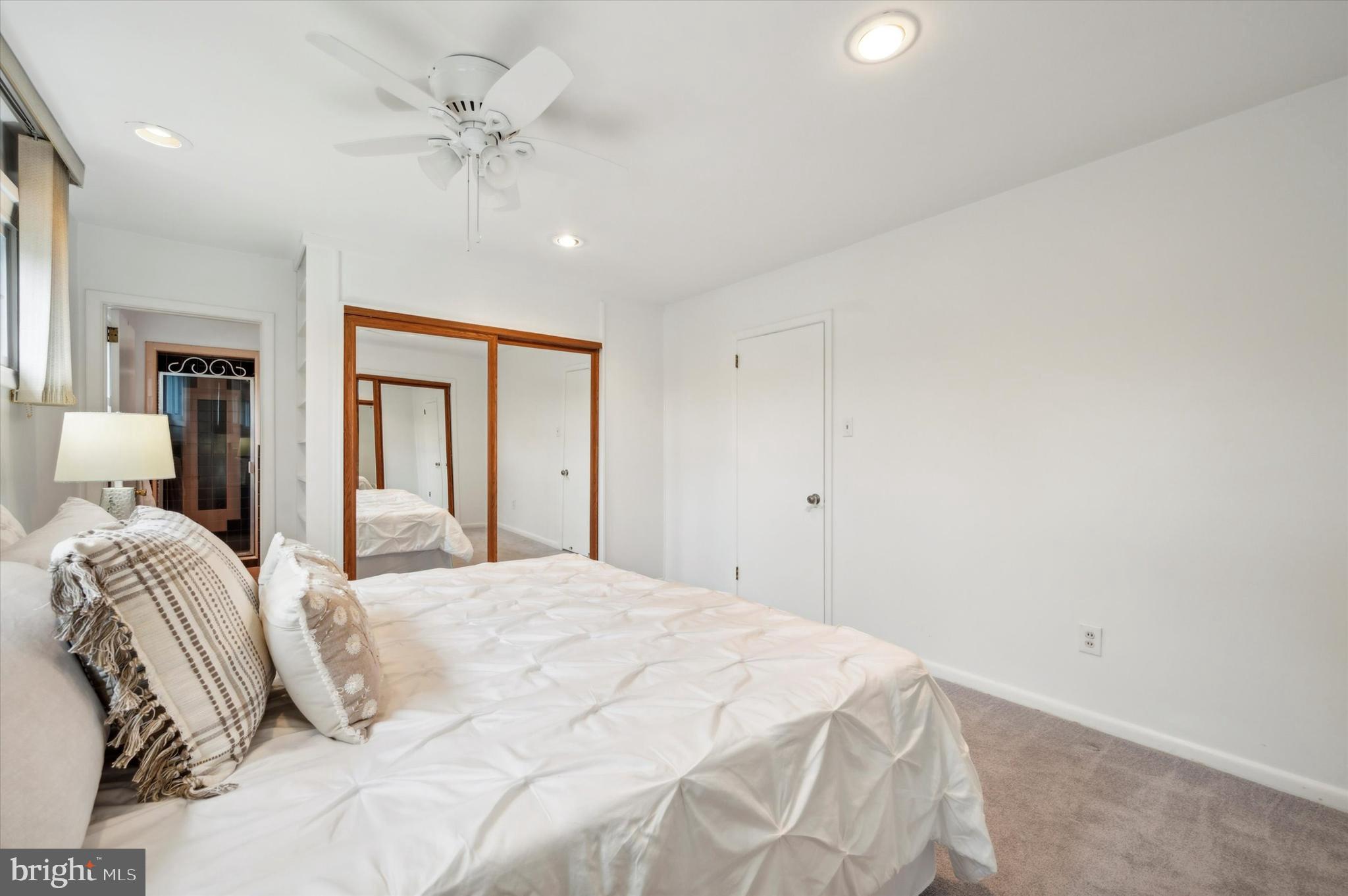 135 Cornell Road Bala Cynwyd, PA 19004 - Photo 18 of 37 a bedroom with a large bed and a chandelier