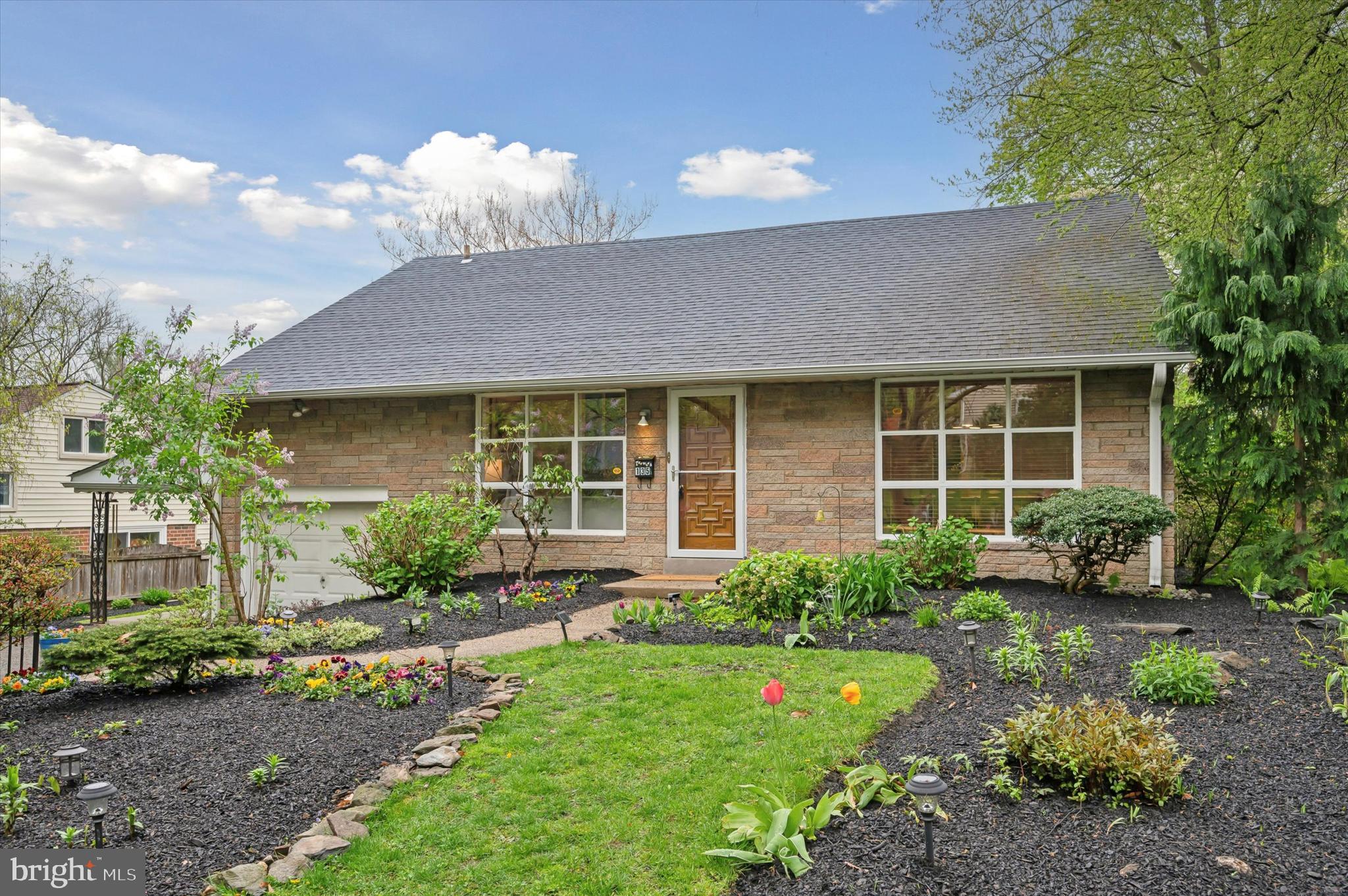 135 Cornell Road Bala Cynwyd, PA 19004 - Photo 2 of 37 a front view of a house with garden and porch