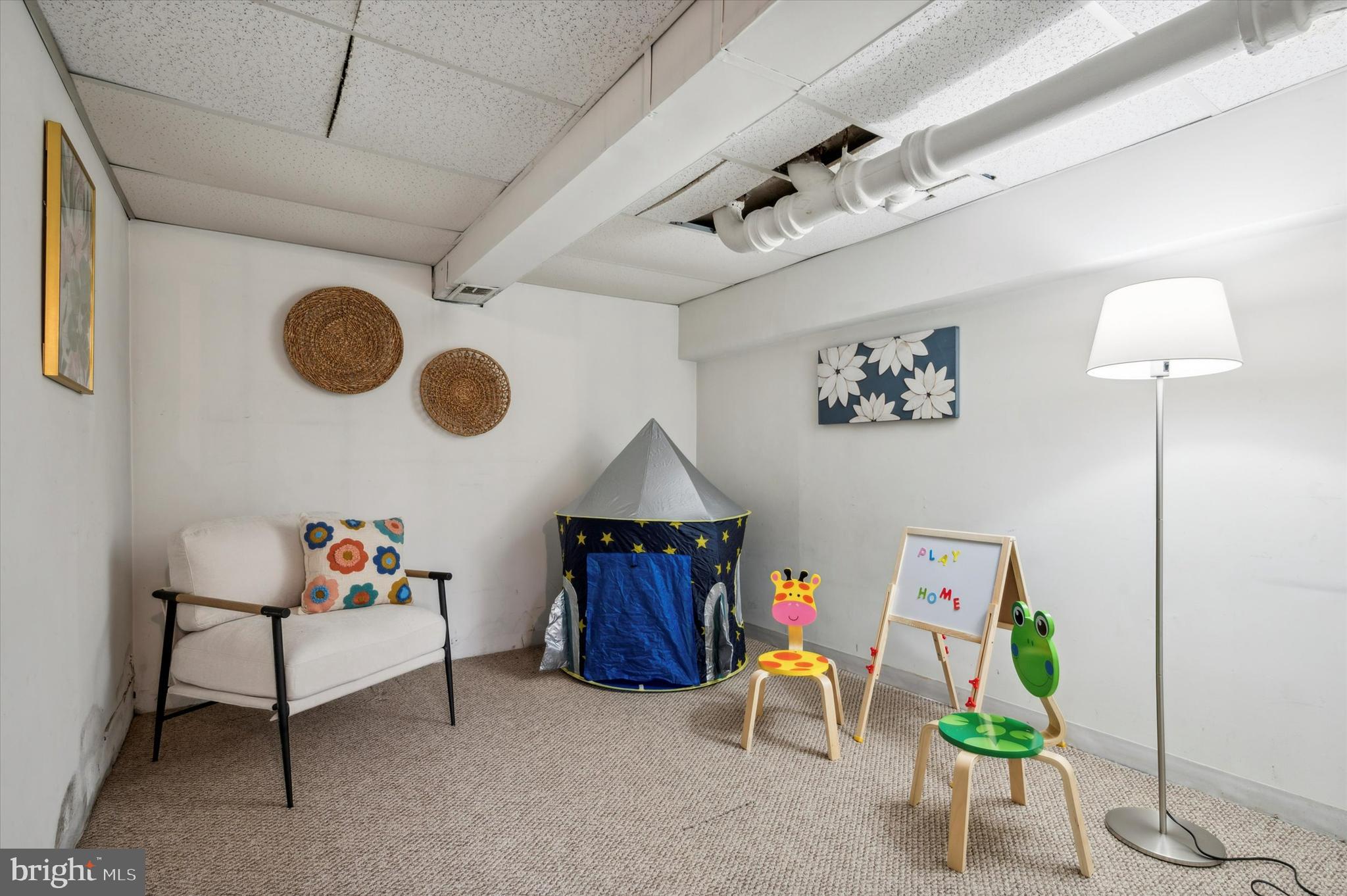 135 Cornell Road Bala Cynwyd, PA 19004 - Photo 29 of 37 a living room with furniture and a chandelier