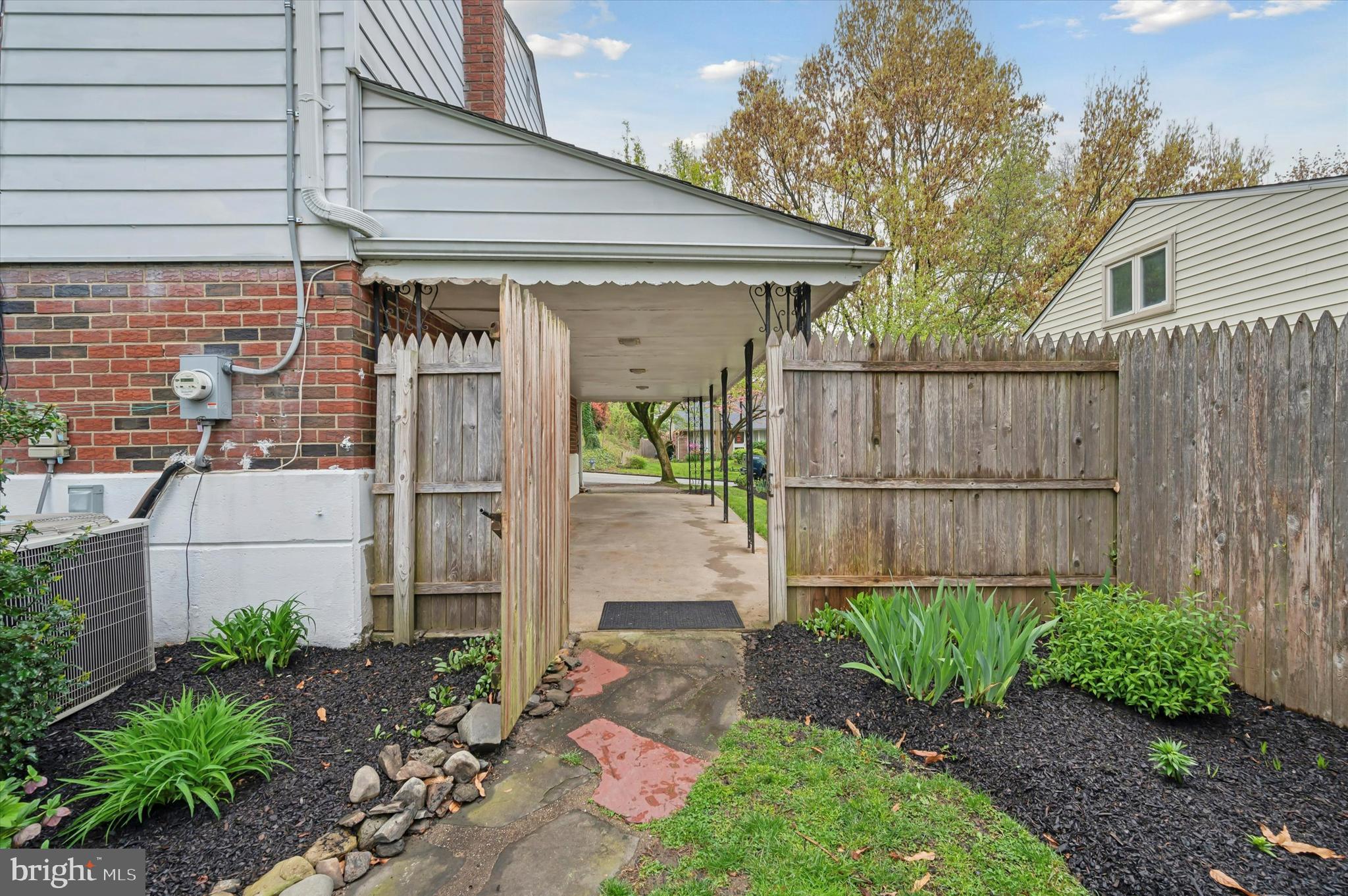 135 Cornell Road Bala Cynwyd, PA 19004 - Photo 30 of 37 a backyard of a house with plants and outdoor seating