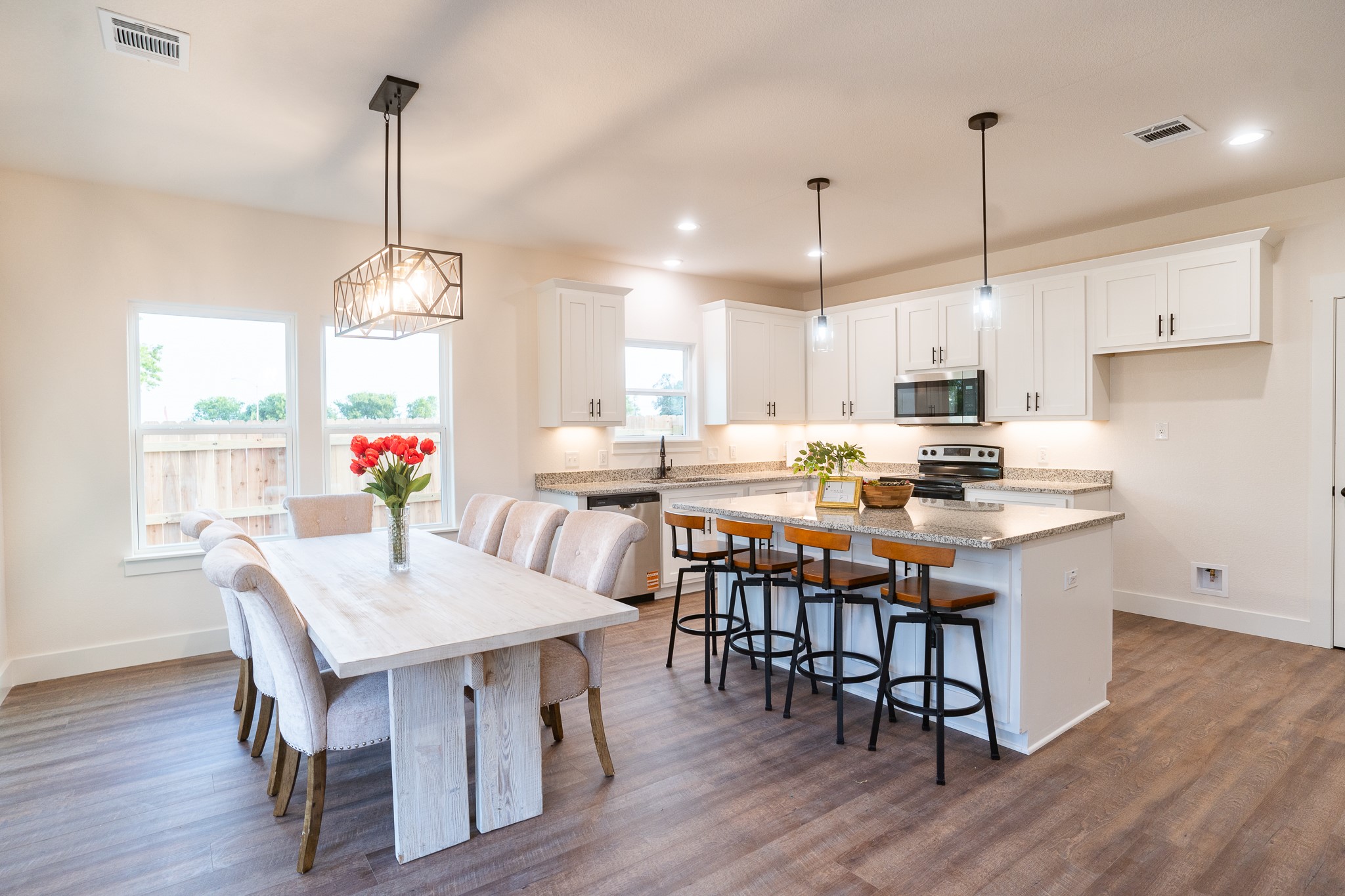 304 String Prairie Way Smithville, TX 78957 - Photo 7 of 30 Dining space featuring baseboards, healthy amount of natural light, dark wood finished floors, and recessed lighting
