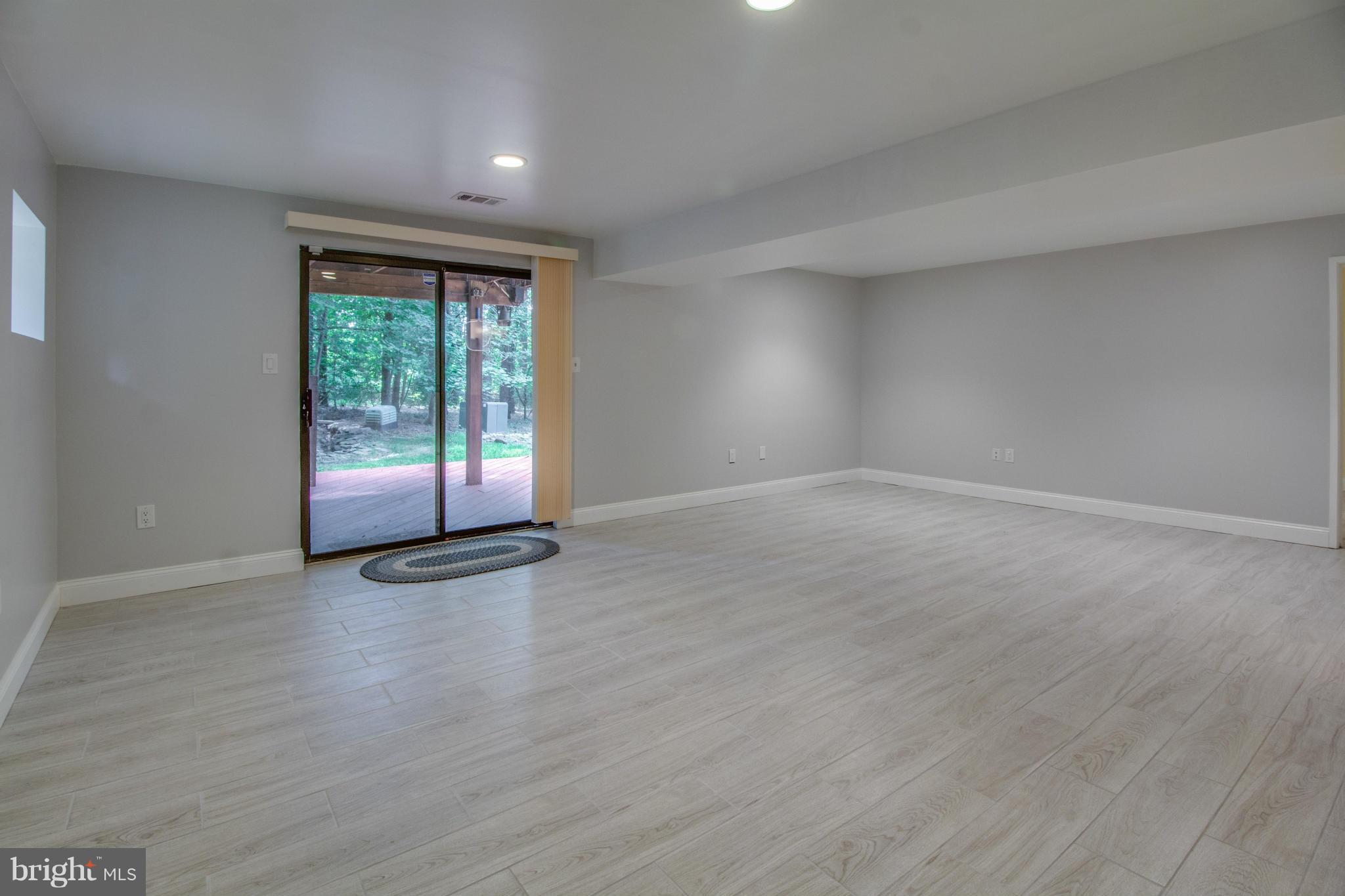 1673 Cedar Hollow Way Reston, VA 20194 - Photo 19 of 30 Rec Room w/ wet bar and walk-out to deck